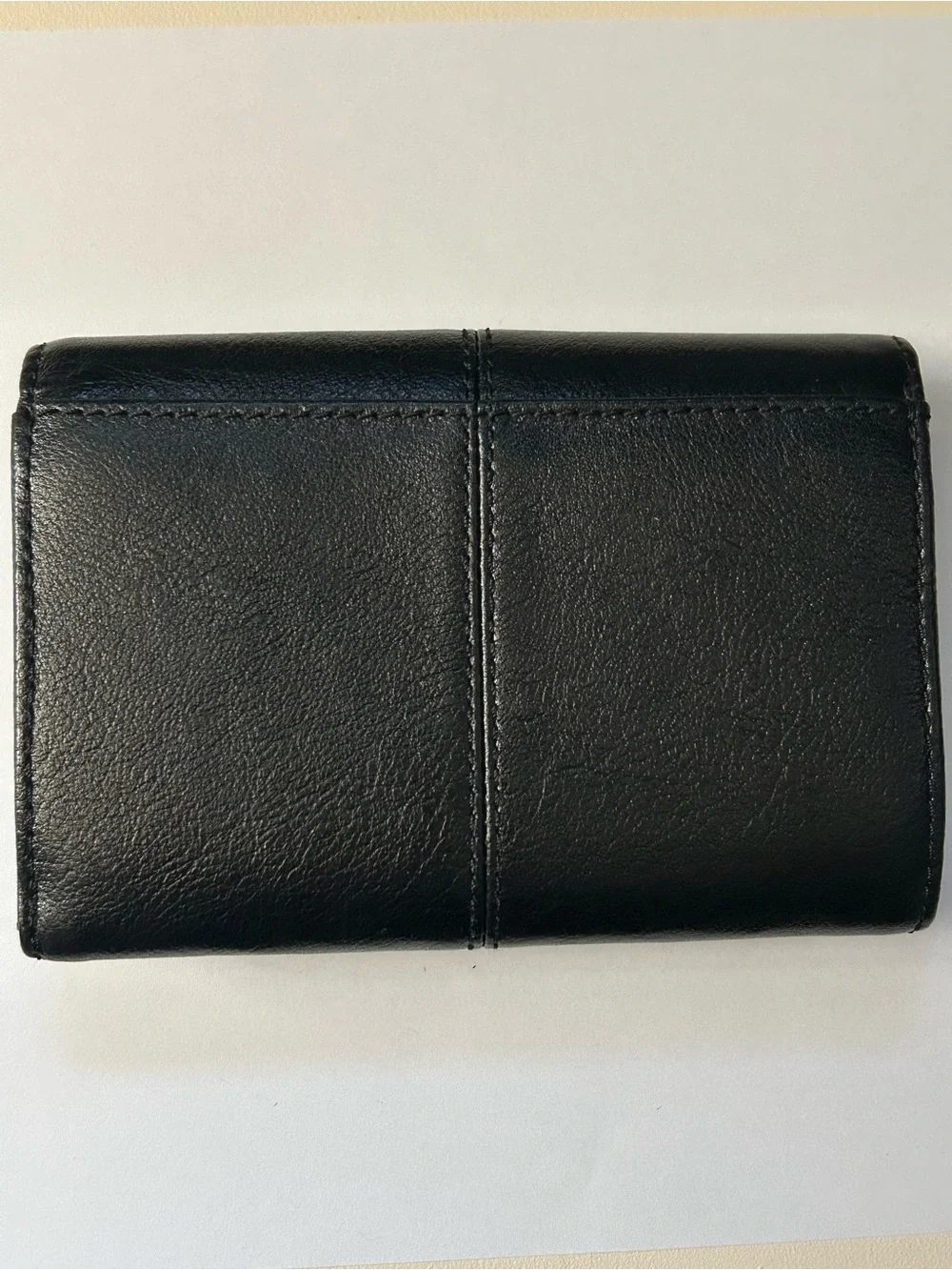 Coach Women’s Black Tri-Fold Wallet with Gold Script Logo
